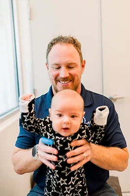 Chiropractor Bakersfield CA William Perry Adjusting Infant